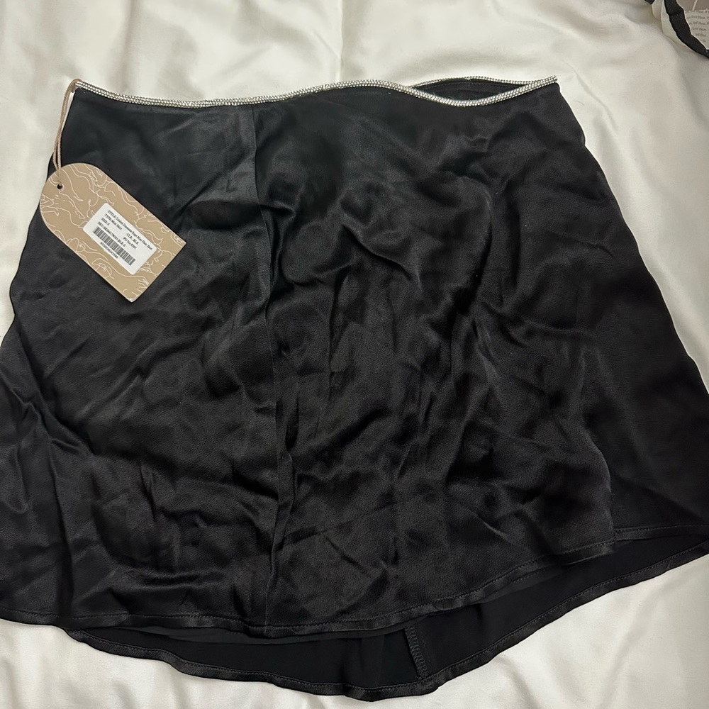 Brand new Black sating mini skirt size small with diamond detailing